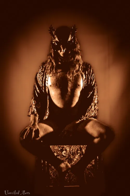 “Eyes carved from amber, soul stitched with sky. by UnveiledAura