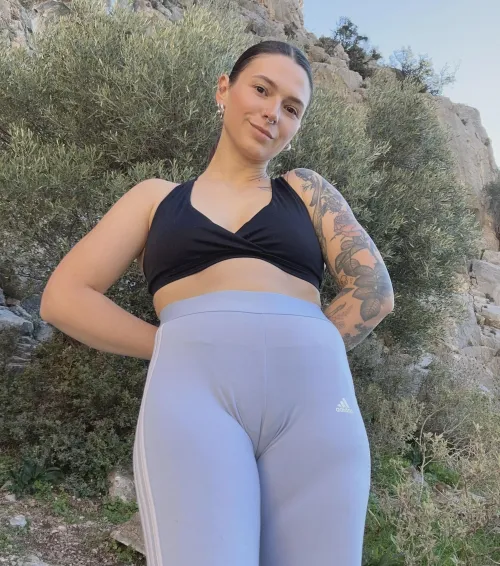 Smiling tattooed babe with nose piercing shows off her camel paw by greenwattermelon