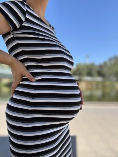 My bump and I enjoying the warm weather. Would you like to go sun bake with me? by SeraphinaStorm