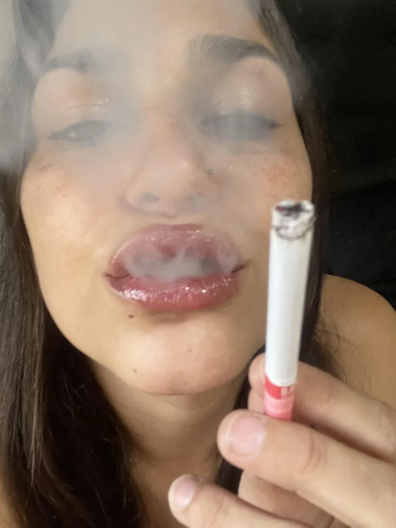 blowing smoke with lips full of gloss posted by misslucysugar
