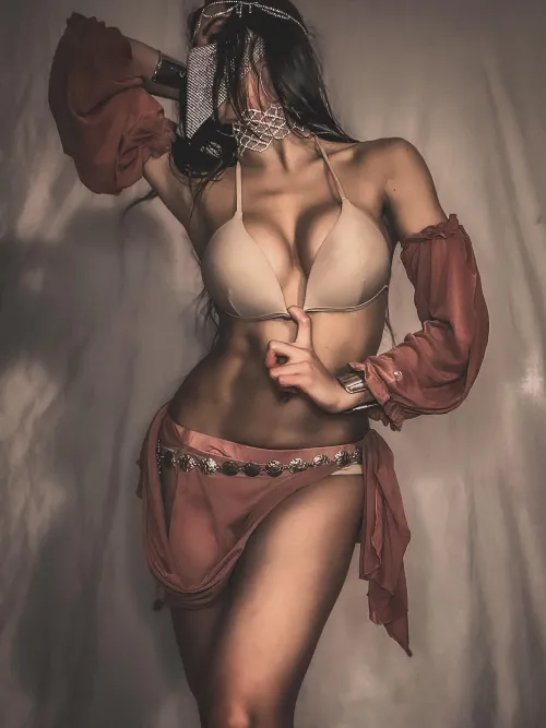 Chains and gems catch the light against warm skin by Belladancer_beauty