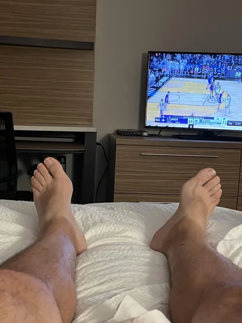 Crazy long work week for this Dad (47), and now relaxing with the game. Would be ideal to have someone rubbing these right now. by RubDadsFeet