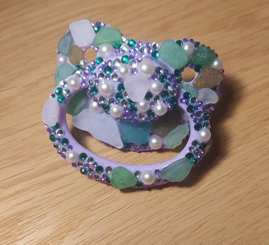 Decorated pacifyer with glass pieces and gems. Sea glass happens to be a special interest of mine besides bdsm by Slave_Schatz