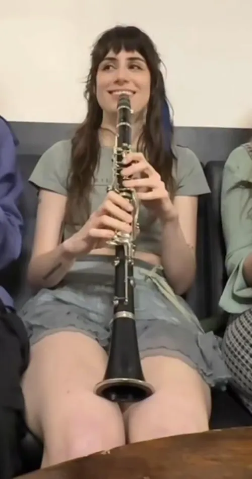 Dodie thighs while playing clarinet by Schwifty21