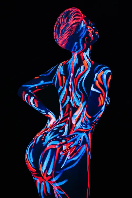 Fluorescent bodypaint under UV light by Fluorfilm