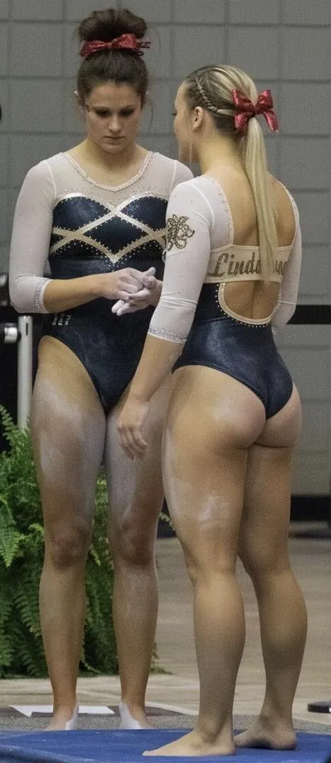 Gymnasts with red bows posted by RoutineWild32