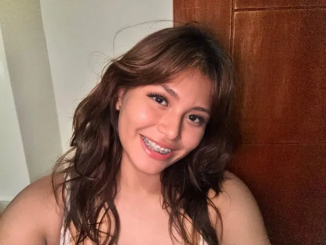 Her unadorned face simply adds to her charm, Revealing a self-assured beauty that requires no embellishment. by Novel_Bar_5518