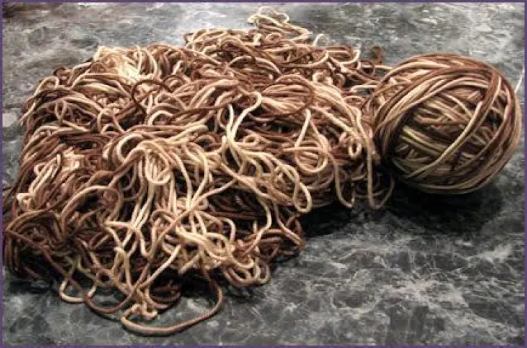 I understand the first part of knitting, but afterwards it curls up and I get these uneven stitches. What am I doing wrong? by wyoming_rider