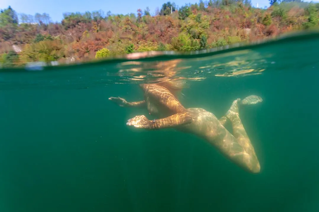 in the river posted by naturism-girl