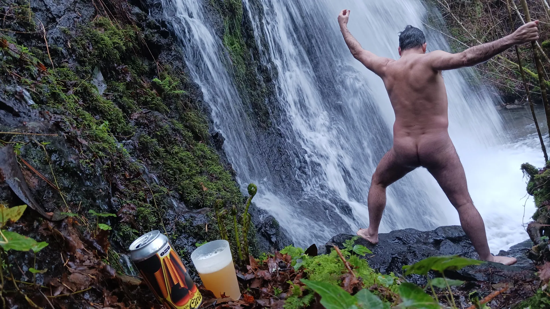 In the waterfall... beer & nudist time posted by nudebodytime