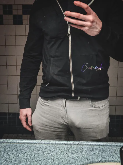 Just noticed this in the office bathroom mirror. A bit more visible than I realized. by -chemosh-