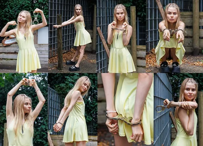 Ksenia cuffed to a metal frame by lanfeust97