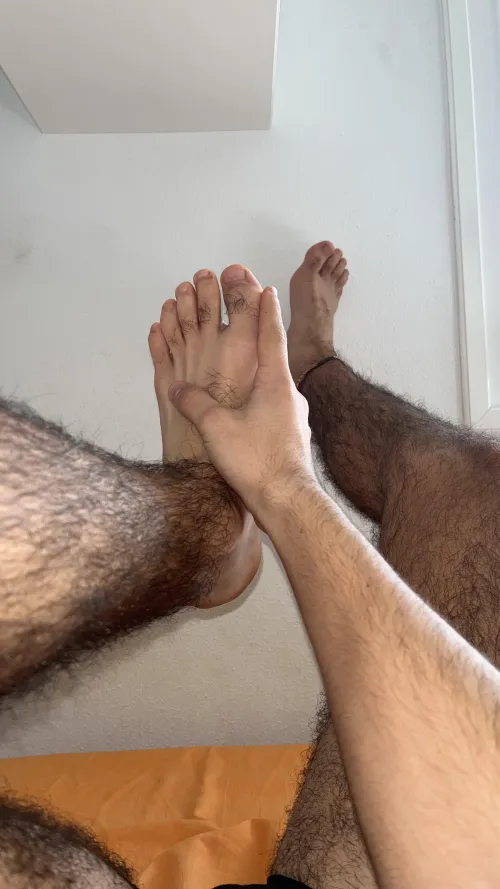 Last night was insane...  Woke up like this, too tired to move. Anyone want to help me relax these tired, hairy legs?  by feettxer