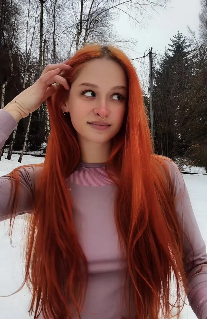 Long hair keeps me warm in winter posted by RedheadFairy03