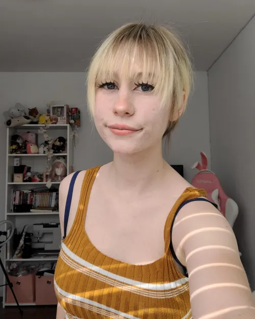 My hair's pulled back but I can assure your it's short ;D by [deleted]