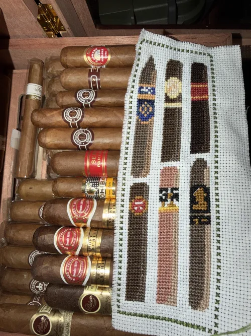 My wife has been joining me for cigars more. She made me this lovely bookmark today, and we are both wondering what brand the cigar with the blue band is? (patterns are from etsy) by Awkwardly_Satisfied