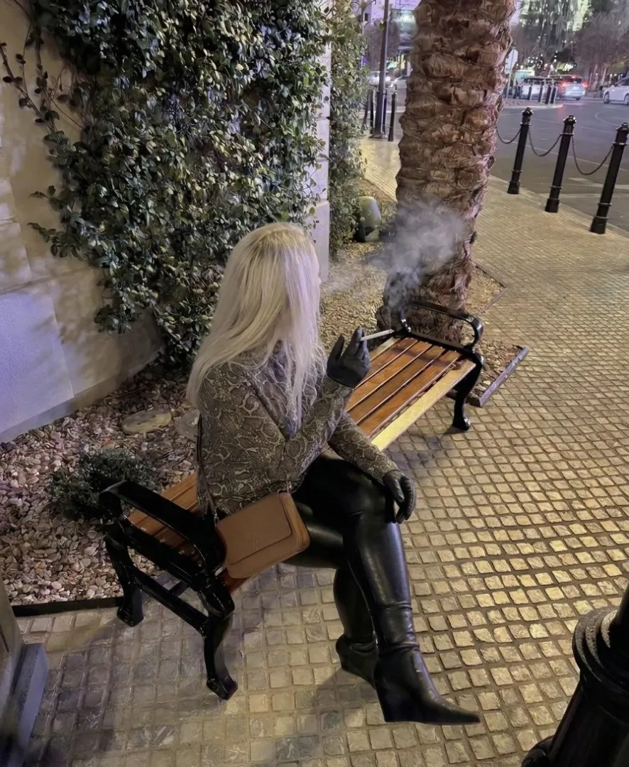 One of the few non-smoking hotels in Vegas…
so I found a quiet bench outside for a proper cigarette break, leather, boots crossed, and a little late-night boot fetish vibe while the smoke drifts into the night.  posted by heeledobsession