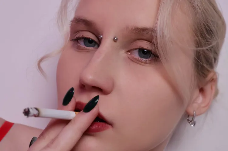 Piercing gaze, thick cigarette smoke by MertyXXX