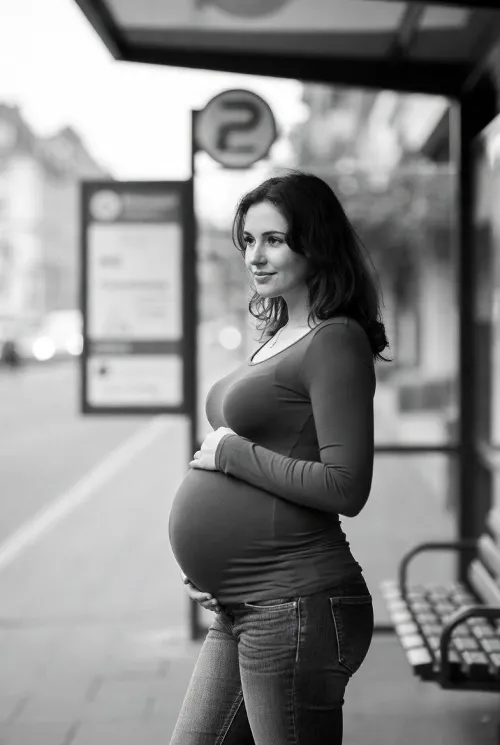 Pretty pregnant woman waiting for the bus by phil-1986
