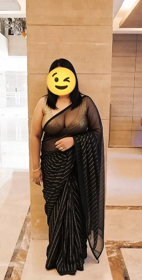 School: pleats tight, blouse sealed — untouchable teacher, zero skin. Weekend: sheer black net clings like sin, deep gold plunge, nipples teasing, body begging to be claimed. Orthodox by weekday… shameless flaunt by the weekend . Forbidden to fuckabl by Radiant_Apple3034