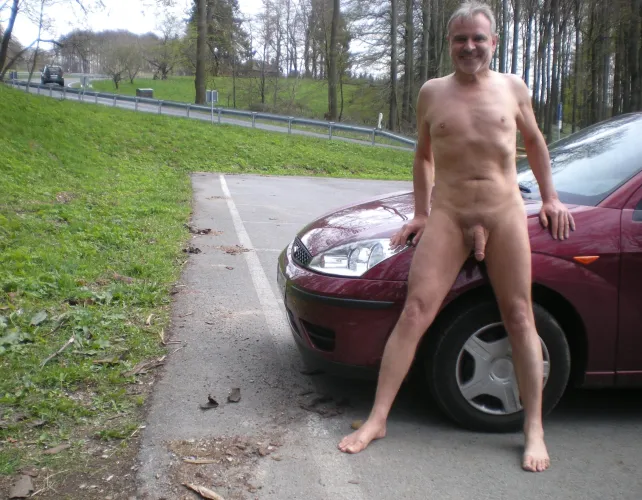 Standing with red car by Neither_Ant_3909