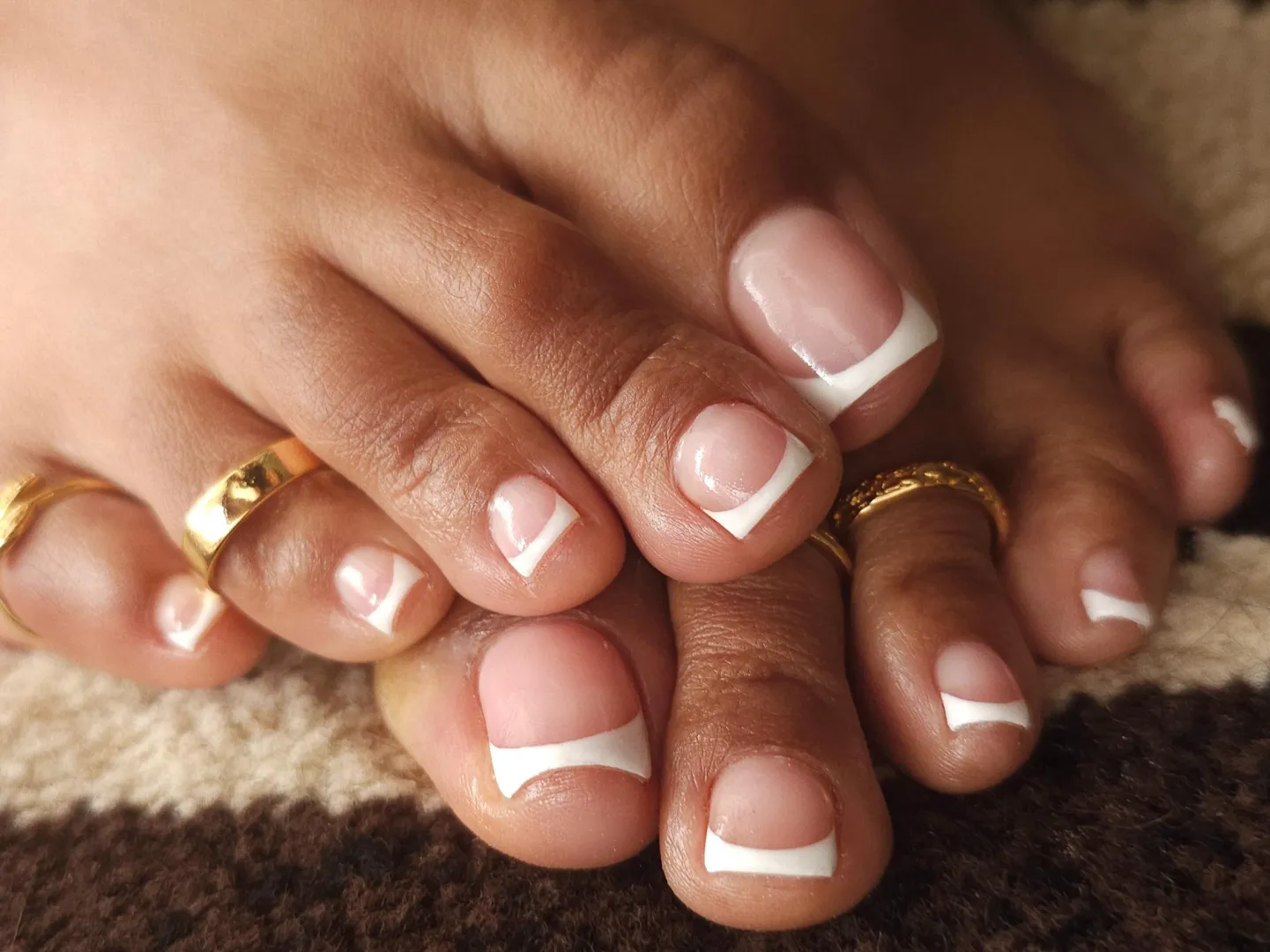 Sun out, toes out! Fresh Frenchies with toe rings ✨️ posted by BrownGreekToeGoddess