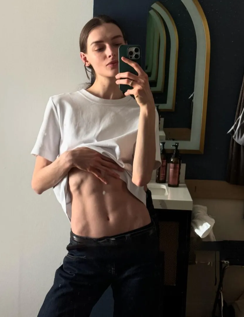 Taking a mirror selfie posted by EchoOfEnnui