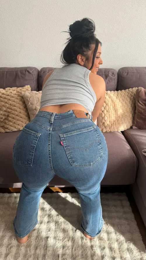 Tanned curves in tight denim igniting bold energy ruling the shore with fiery warmth by Galadriel69_