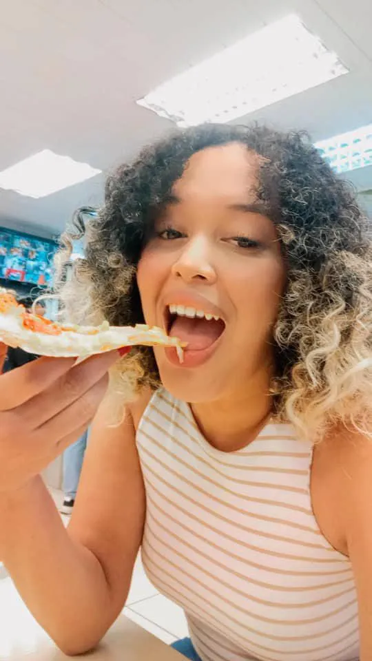 Testing the limits of my favorite top with some pizza.  It’s getting tighter with every bite! [F26] posted by Fluid_House_74