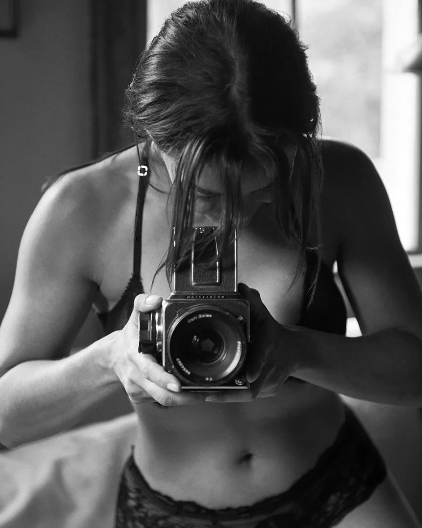These days I only use it as a prop, but back in the day this was my main camera. Black Lingerie and Hasselblad 500c/m. posted by stubbornstain