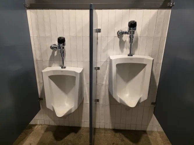 This partition between the two urinals was far too large. by No-Anywhere-2756
