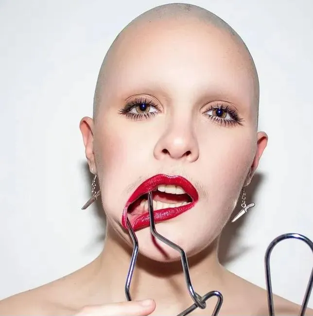 Thought you'd like red lips with my bald head ♥️ posted by Interesting_Face_962