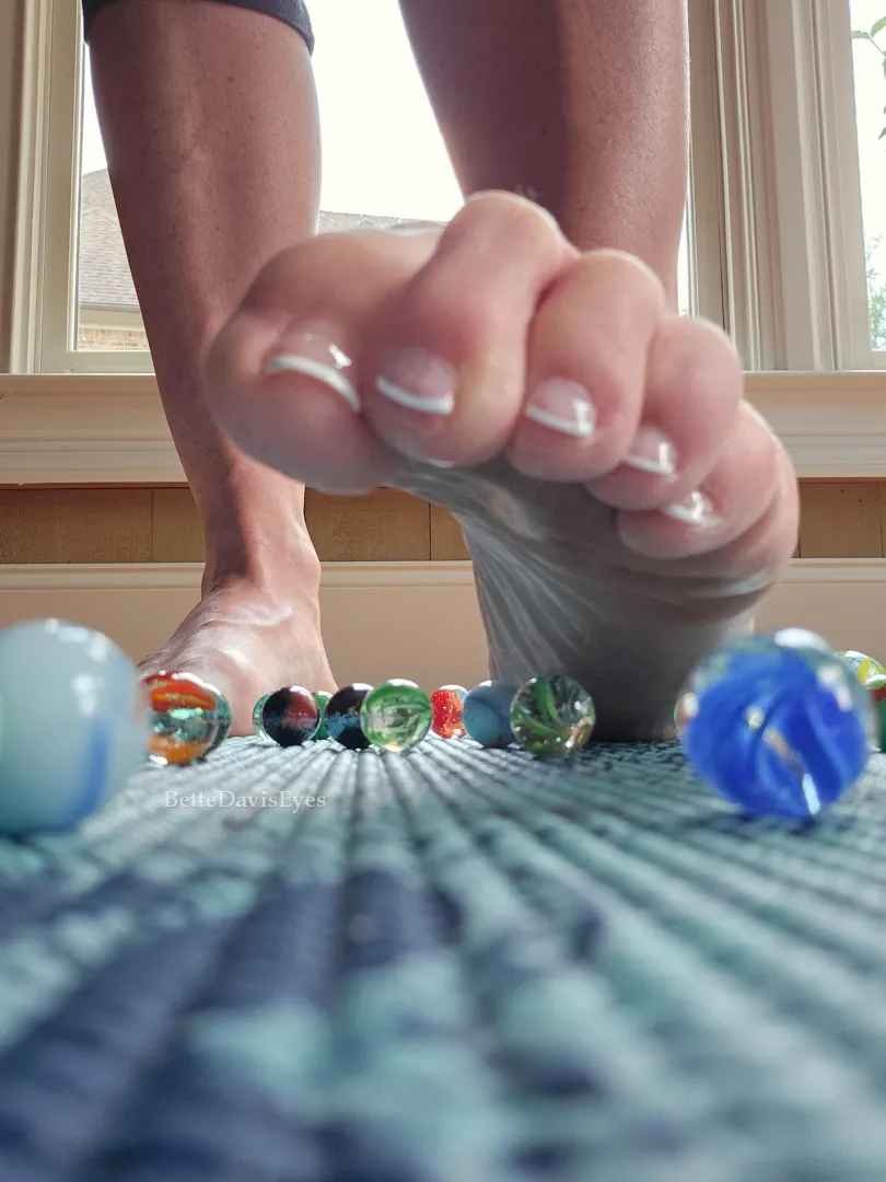 Toes tightening, releasing, selecting the next marble. posted by BetteDavisEyes1