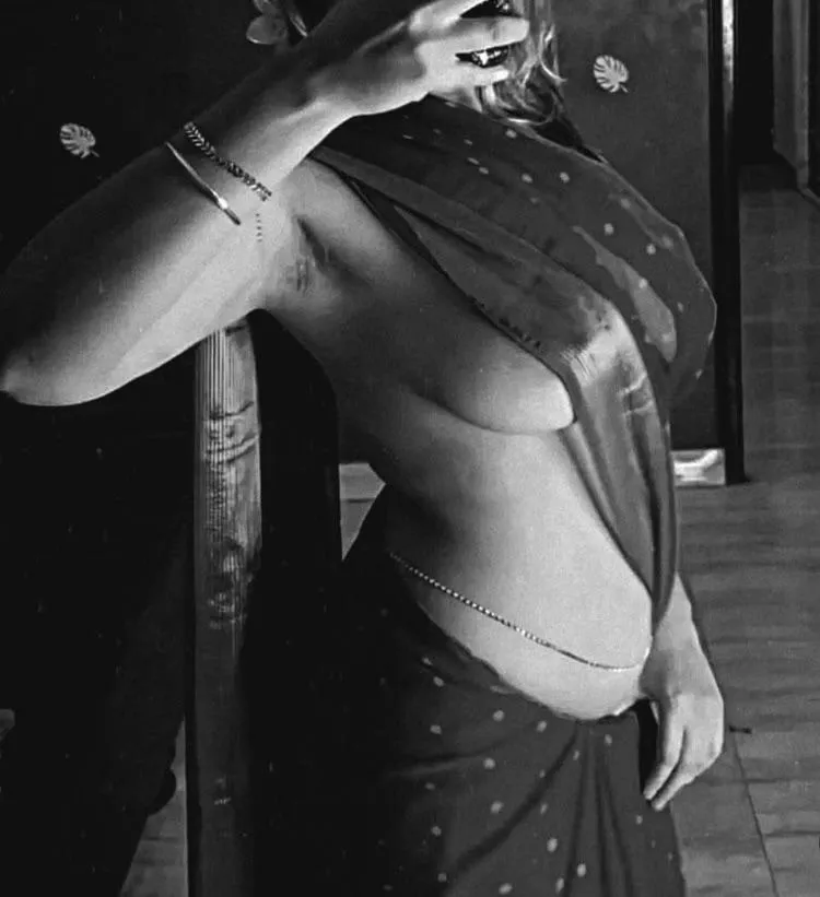 wife’s mirror tease: saree low, heavy tits, pits bush hint. Love the rush of strangers seeing what I get every night  posted by stuffithinkk