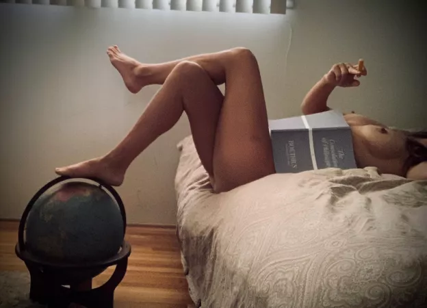 “A nude woman was sitting on the edge of a desk next to a globe of the world. The suggested onanism with the piece of chalk intrigued Ignatius. Her face was hidden behind a large book.” by SchemeKind