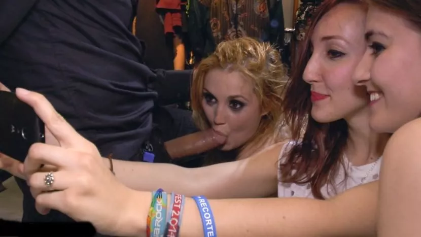 A slavegirl photobombs a selfie in classic slavegirl cock-in-mouth mode posted by patpowers1995