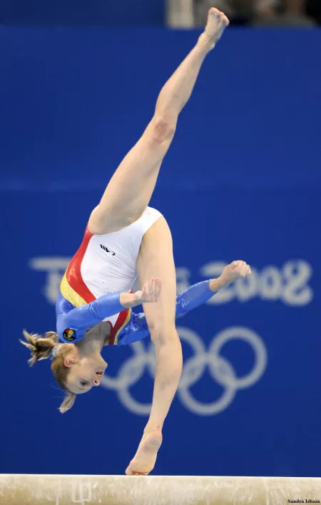 Artistic woman gymnast Sandra Izbasa on balance beam during 2008 olympics by star_form_tree
