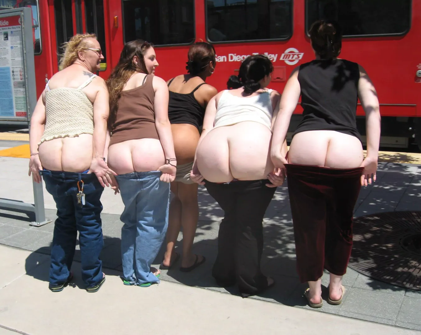 Big group of friends mooning next to train posted by [deleted]
