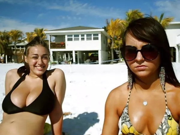 Breast envy on a beach. by Advega