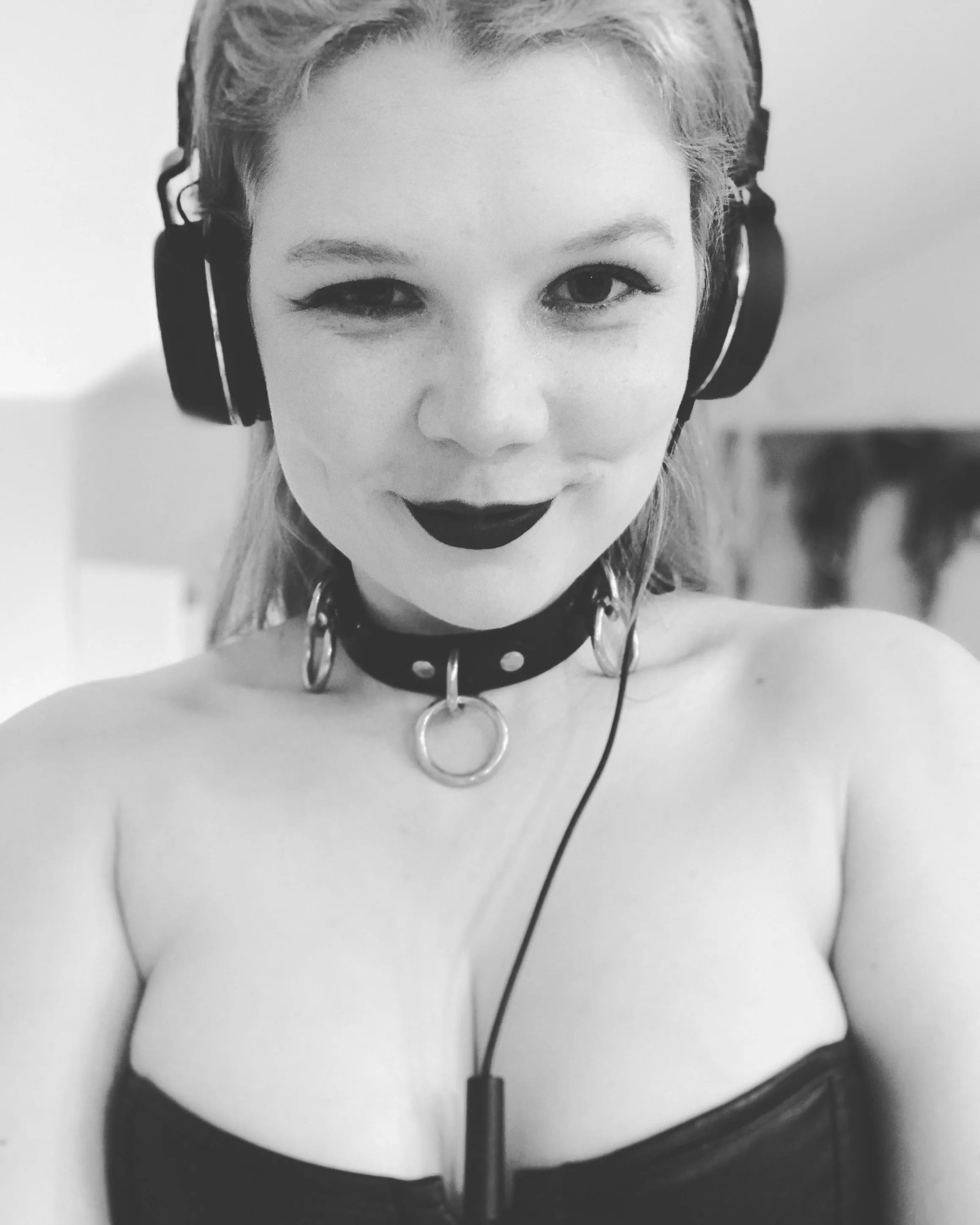 Collar, headphones, and a naughty smile posted by frocksoffantasy