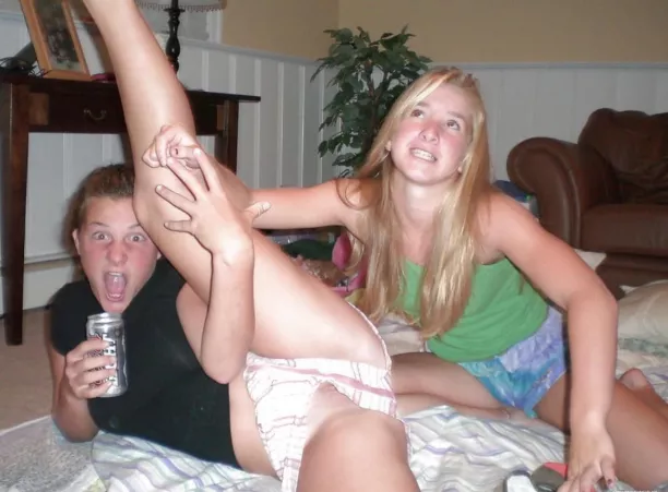 Cutie drinks a beer while her friend stretches her out by MYNAMEIS2183