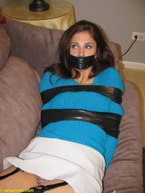 Damsel in black tape posted by pBondage