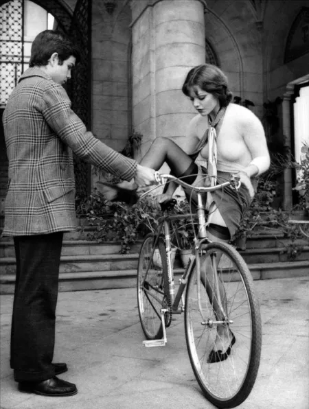 Gentleman helps lady with her bike. by CJ105