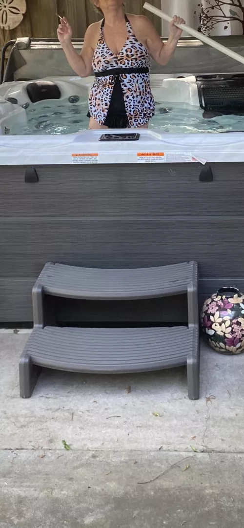 Gilf cleaning the hot tub by National_Society_330