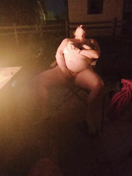 GILF Getting hot by the firepit. by Maturehub