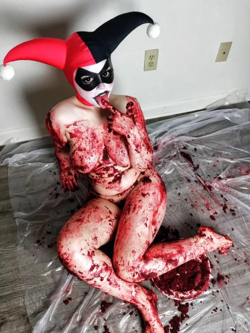Harley Quinn got a little messy sitting on red velvet cake!