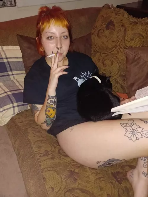 Having a cigarette on the couch with my book and cat! Any book recommendations?:) by bleachpongg