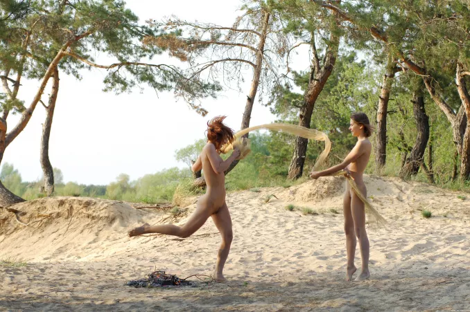Having fun near a campfire on the beach (Katrin & Eva in Sandestin) by NaturistPictures