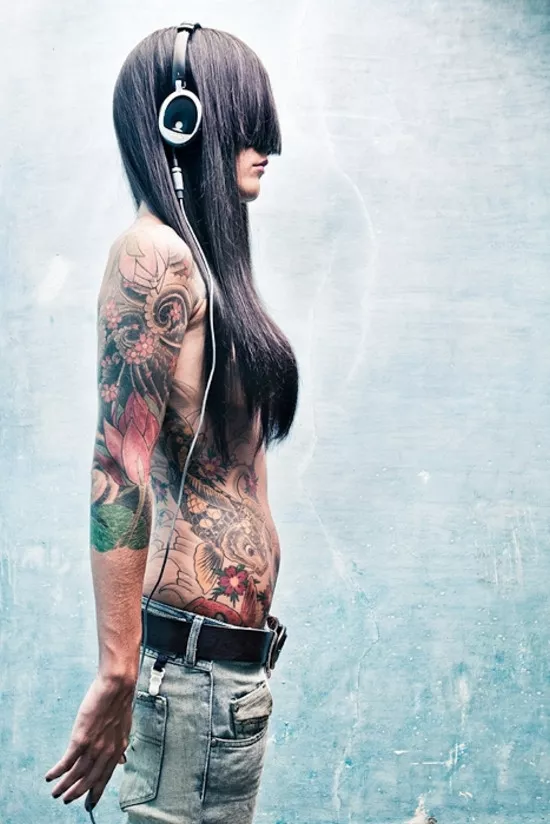 Headphones, tattoos and long bangs (x-post from /r/hotchickswithtattoos) posted by Jordan_Boone