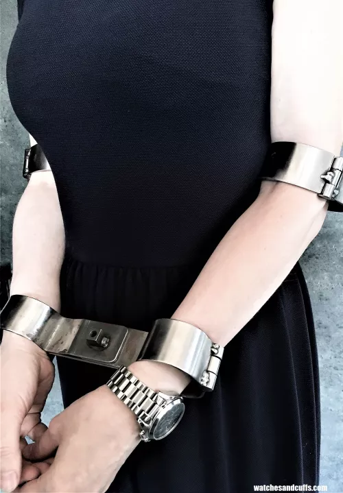 Helpless in steel - elbow shackles and rigid restraints by JessicaShackled